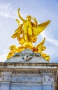 Golden angel sculpture on top of Victoria Memorial in front of Buckingham Palace, London, UK