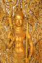 Golden angel in on the wall of temple. Royalty Free Stock Photo