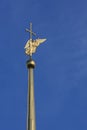 Golden angel with wings and a cross on top of spire of Peter and Paul Cathedral in St. Petersburg, Russia, and Northern Europe.