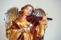 Golden angelic violin musician - horizontal