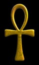 Golden ankh symbol on black background