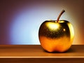 Golden apple on a wooden surface isolated close-up on a gray background