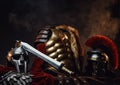 Golden armor between gladiator and legionary helmets