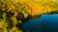 Golden autumn background, aerial drone view of forest with yellow trees and beautiful lake landscape from above, Kiev, Ukraine Royalty Free Stock Photo