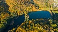 Golden autumn background, aerial view of forest with yellow trees and beautiful lake landscape from above, Kiev, Goloseevo forest Royalty Free Stock Photo