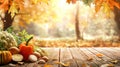 Golden autumn background with trees and a few fresh vegetables on top of the table