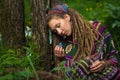 Romantic girl in the forest. Holds the Butterfly on his hand