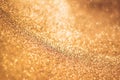 Golden background with bokeh and glitter, valentine`s day, christmas and new year background, selective focus Royalty Free Stock Photo