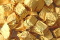 Golden Background. Ingots or Nuggets of Pure Gold. Gold leaf. Te Royalty Free Stock Photo