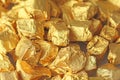 Golden Background. Ingots or Nuggets of Pure Gold. Gold leaf. Tea Resin Puer Royalty Free Stock Photo