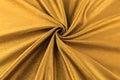 Golden background luxury cloth or wavy folds of grunge silk texture satin Royalty Free Stock Photo