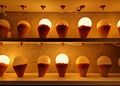 Golden Background of Illuminated Light Bulbs in Ice Cream Cone Mock-up