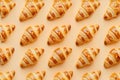 Golden Baked Croissants on Warm Beige Background for Culinary Concepts