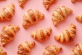 Golden Baked Croissants on Warm Pink Background for Culinary Concepts