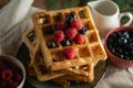 Golden baked waffels with fresh berries