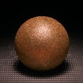 Golden ball.Black background.Sphere.Shadow.Still-life
