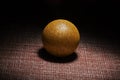 Golden ball.Black background.Sphere.Shadow.Still-life