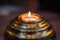 Golden ball candle flaming in the dark Royalty Free Stock Photo