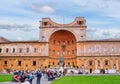 Golden Ball sculpture and Belvedere palace in courtyard of Vatican Museum