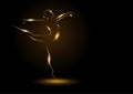 Golden ballerina on dark background