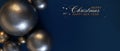 Golden balloons on dark blue background. Merry Christmas dark blue banner with golden Christmas toys balls. Royalty Free Stock Photo