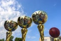 Golden basketball cups against the sky Royalty Free Stock Photo