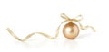 Golden christmas ball with a ribbon decoration, isolated on white background. Royalty Free Stock Photo