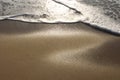 golden beach, glittering sand and sea water sunset light background and texture wallpaper pattern. Royalty Free Stock Photo