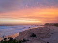 Golden beach and sea at sunset.