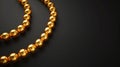 A golden bead necklace on a dark background. Can be used in jewelry advertisements or luxury item showcases, embodying Royalty Free Stock Photo