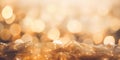 Golden beautiful blurred bokeh background with copy space. Holiday texture. Wallpaper. Glitter light spots on golden background,