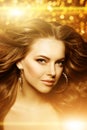 Golden beautiful fashion woman, model with shiny healthy long v Royalty Free Stock Photo