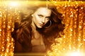 Golden beautiful fashion woman, model with shiny healthy long v Royalty Free Stock Photo