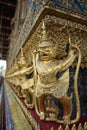 The golden beautiful ornamental of Thailand art & craft of Garuda holding the Naga at The Temple of the Emerald Buddha