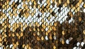 Golden beautiful texture set of round sequins sewn on fabr