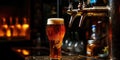 Golden beer being poured from a tap into a pint glass at a cozy bar Royalty Free Stock Photo