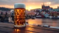 Golden beer in a mug against a sunset cityscape. a refreshing drink on a wooden table. evening relaxation in the city