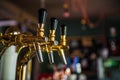 Golden beer tap with blurred background Royalty Free Stock Photo