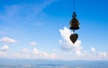 A golden bell hanging against the backdrop of beautiful sky Royalty Free Stock Photo