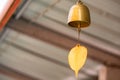 A golden bell hanging under the Thai temple roof Royalty Free Stock Photo