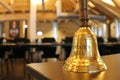 Golden bell in the sunny meeting room Royalty Free Stock Photo