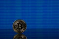 Golden bitcoin, binary code on a blue background