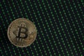 Golden Bitcoin, binary code on a blurry black background