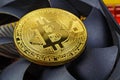 Golden bitcoin on the central processing unit fan background closeup. Cryptocurrency virtual money Royalty Free Stock Photo
