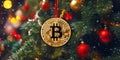 Golden bitcoin on christmas tree background. Cryptocurrency concept