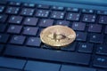 Golden bitcoin coin on computer keyboard, cryptocurrency bitcoin mining concept Royalty Free Stock Photo