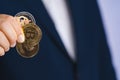 Golden bitcoin coin Dogecoin DOGE, Ethereum ETH group included with Cryptocurrency on hand business man wearing a blue suit. Filed Royalty Free Stock Photo