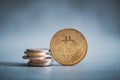 Golden bitcoin coin with euro coins. Euro coins stacked on each other and on the top is bitcoin. Euro versus cryptocurrency. Royalty Free Stock Photo