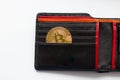 Golden bitcoin coin inside a black leather wallet Royalty Free Stock Photo