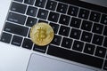 One Golden bitcoin coin on laptop keyboard Royalty Free Stock Photo